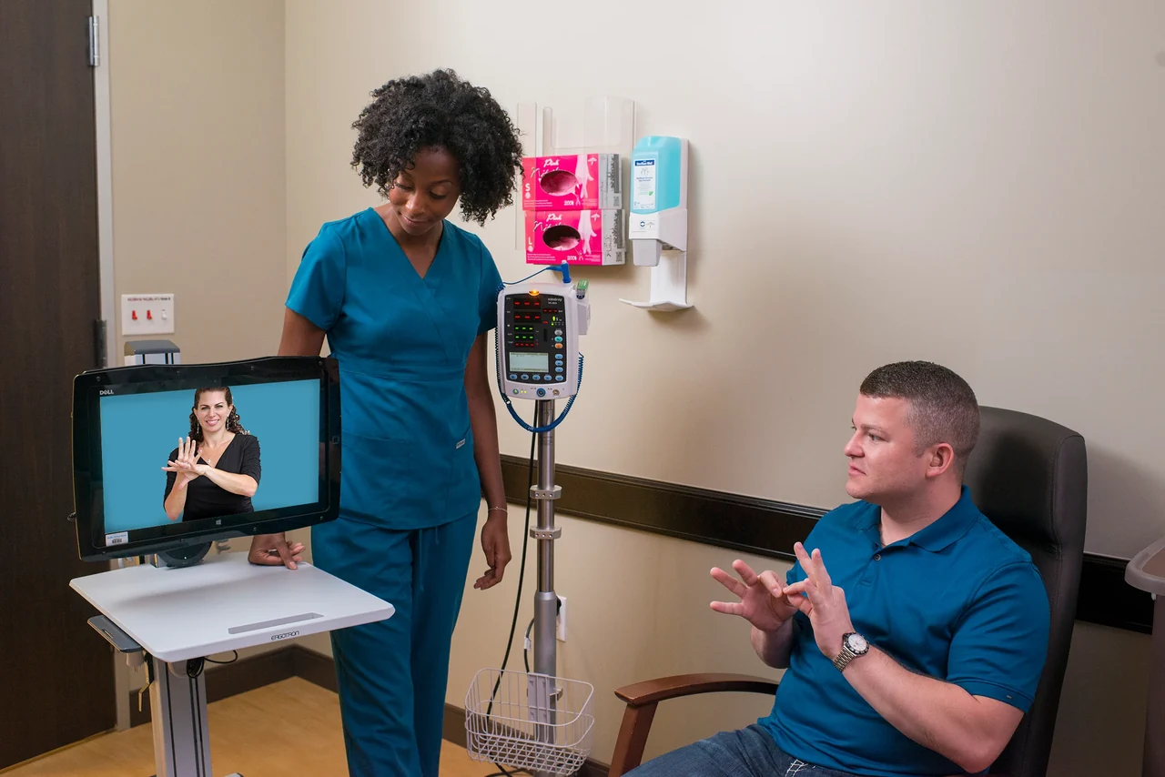 Patient using video sign language support accompanying translation services Patient using video sign language support accompanying translation services